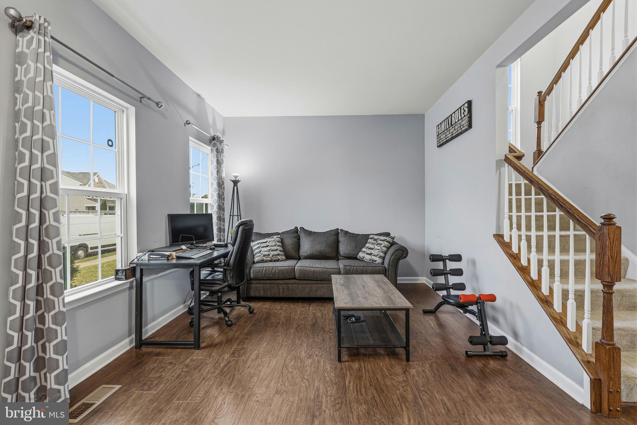 28 Snow Branch Road Clayton, DE 19938 - Photo 10 of 69 a living room with furniture and a wooden floor