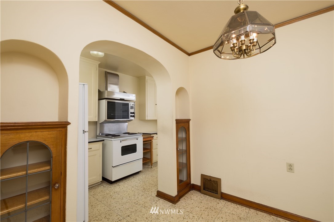 709 North 68th Street Seattle, WA 98103 - Photo 8 of 34 a kitchen with a stove and a microwave