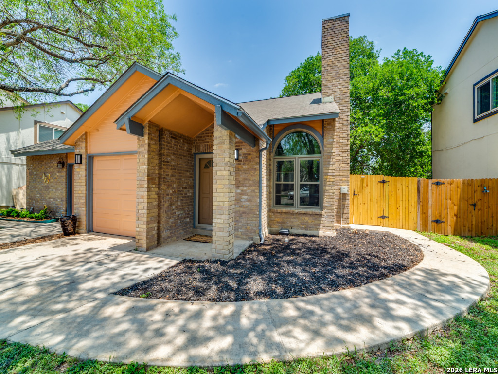 3439 Ridge Ranch San Antonio, TX 78247 - Photo 3 of 25 a front view of a house with a yard