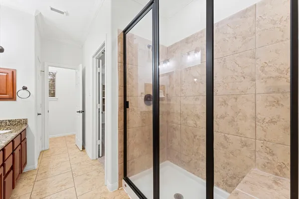 a bathroom with a bathtub and shower