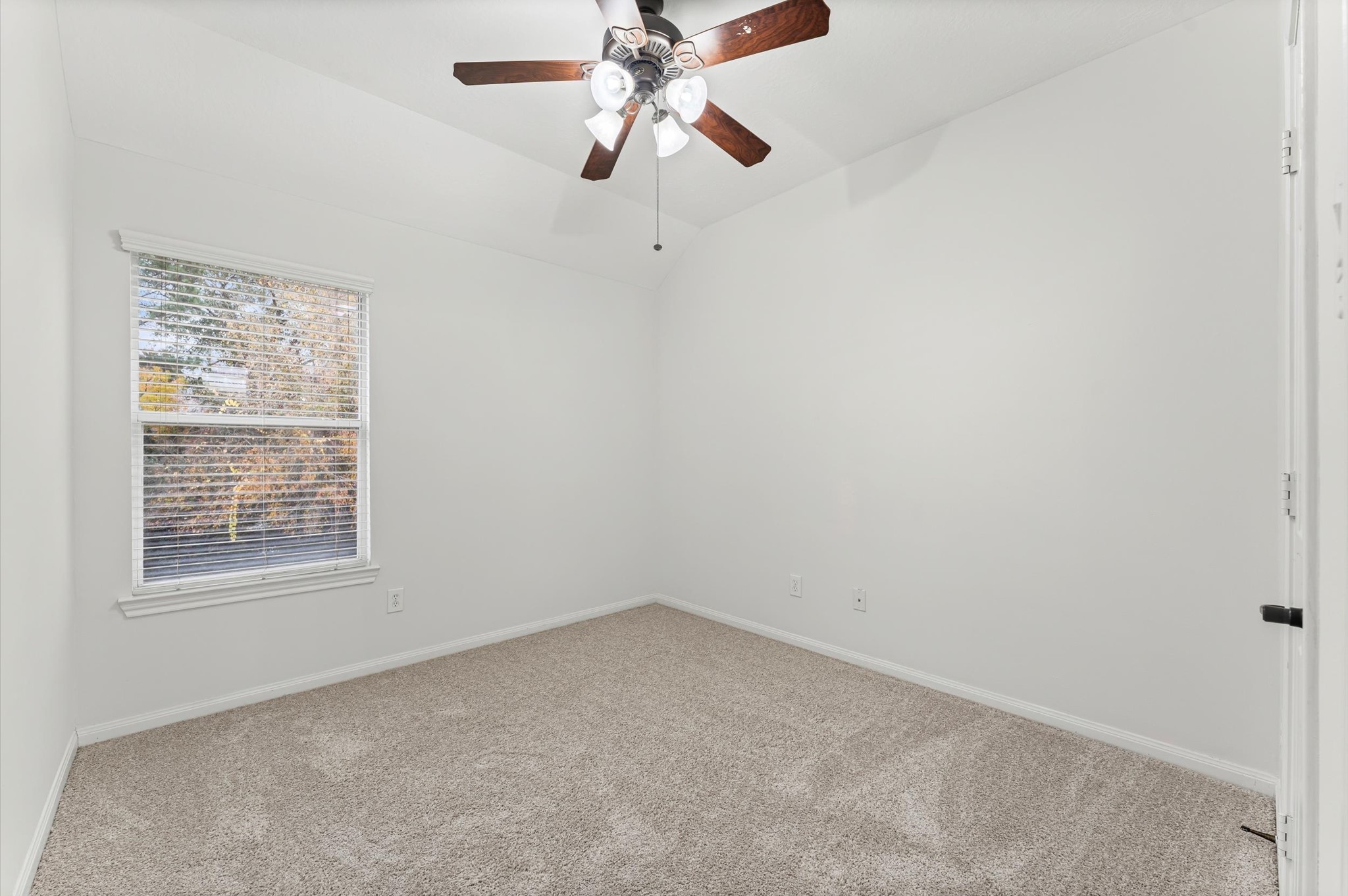 133 East Montfair Boulevard Spring, TX 77382 - Photo 14 of 22 an empty room with a window and a fan