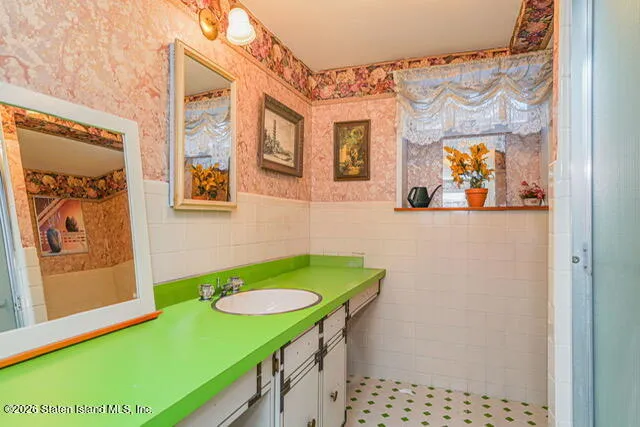 a bathroom with a sink and a mirror