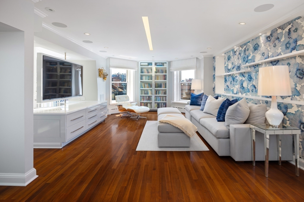 4 Gloucester Street Boston, MA 02115 - Photo 27 of 32 a living room with furniture and a large window