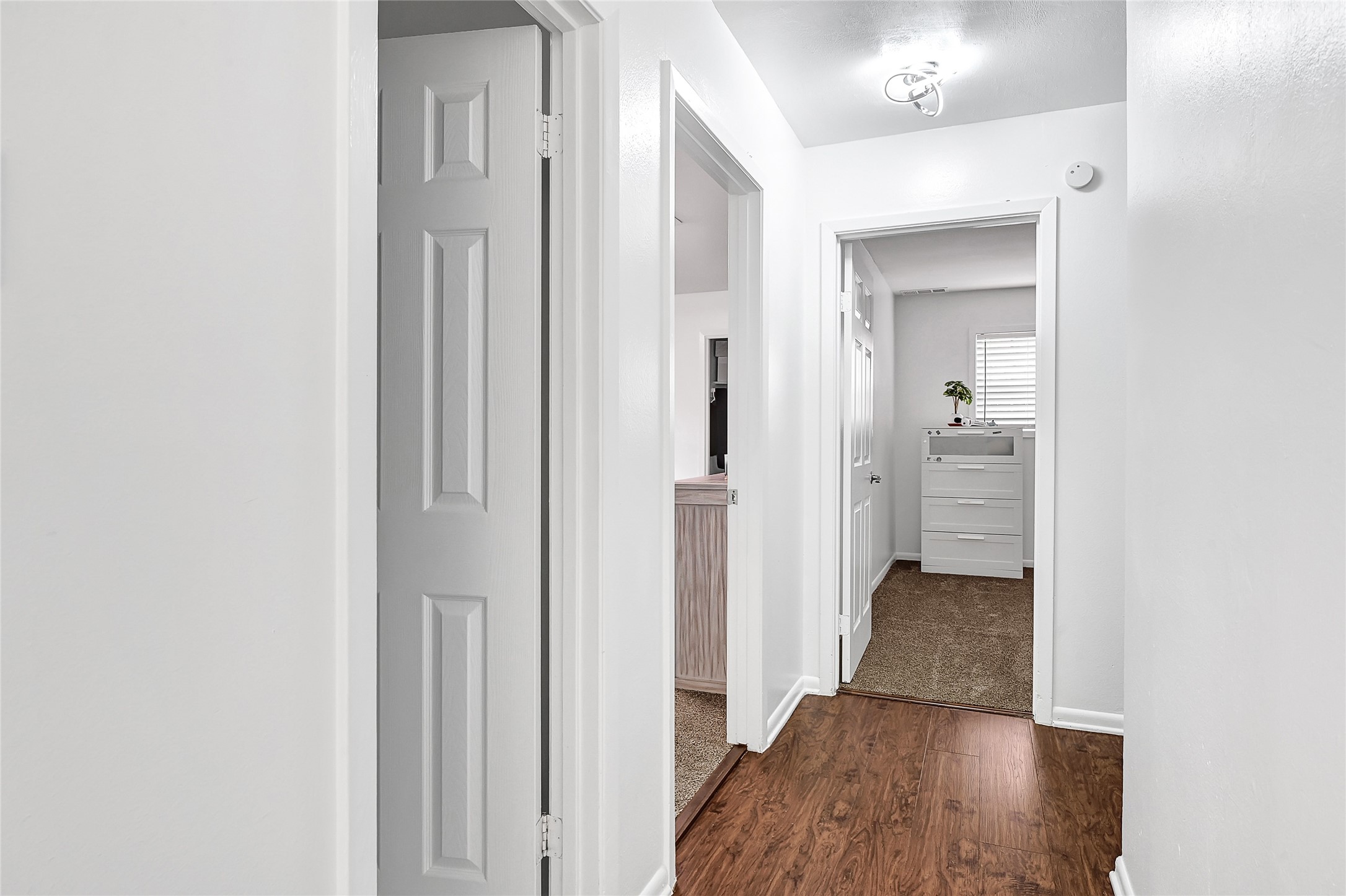 2016 South Houston Road Pasadena, TX 77502 - Photo 17 of 24 a view of a hallway with wooden floor