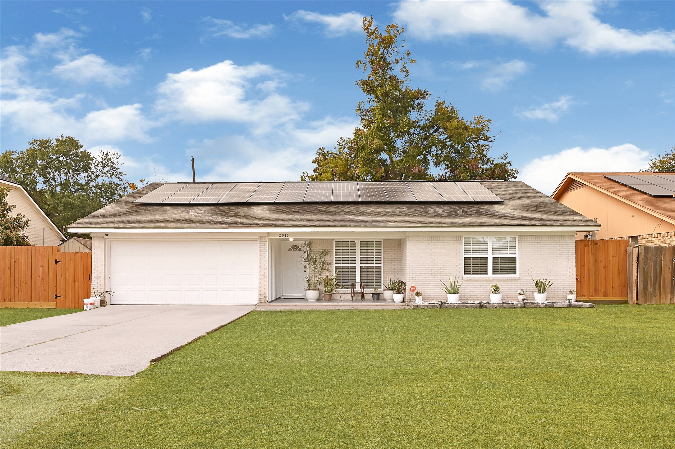 2016 South Houston Road Pasadena, TX 77502 - Photo 2 of 24 a front view of house with yard seating and green space