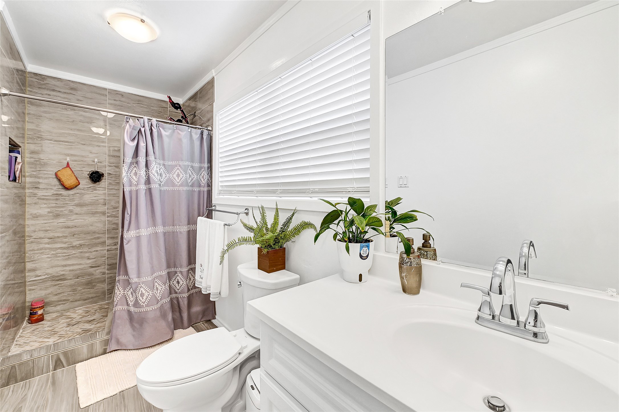 2016 South Houston Road Pasadena, TX 77502 - Photo 21 of 24 a bathroom with a sink a toilet and shower
