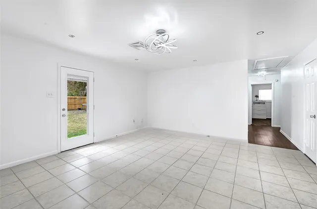 a kitchen with granite countertop white cabinets and a stove