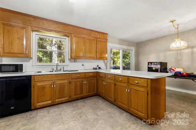 a kitchen with sink cabinets and window