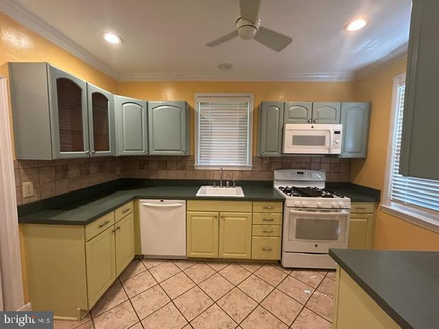 306 Kingston Road Baltimore, MD 21229 - Photo 8 of 17 a kitchen with stainless steel appliances granite countertop a stove a sink and a microwave