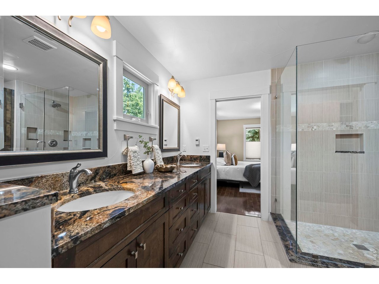 4824 Briar Ridge Court Boulder, CO 80301 - Photo 15 of 40 a bathroom with a granite countertop sink mirror and a