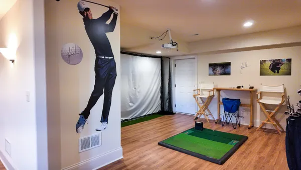 a view of a hallway with a dining room a livingroom with furniture and wooden floor