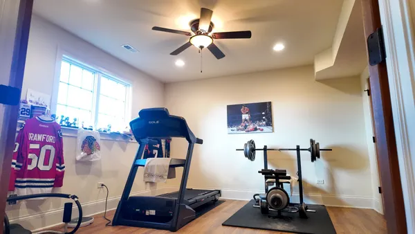 a room with gym equipment and a window