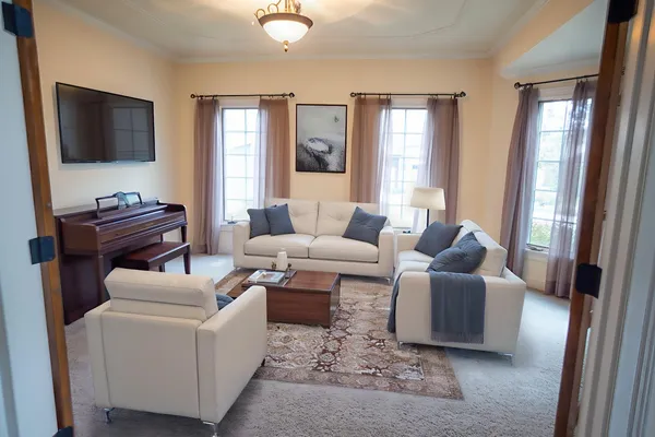 a living room with furniture and a flat screen tv