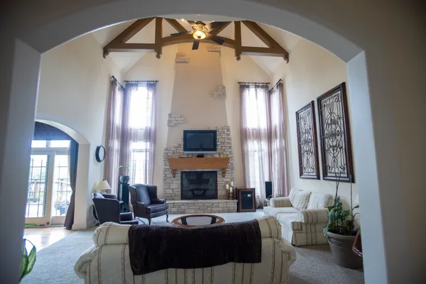 a living room with furniture and a fireplace