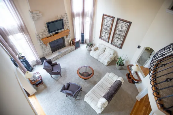 a living room with furniture and a flat screen tv