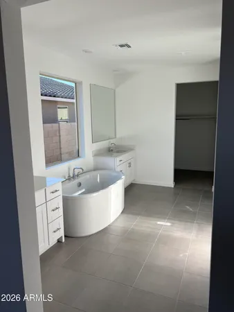 a bathroom with a bathtub and shower