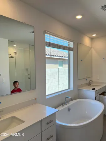 a bathroom with a bathtub and a sink