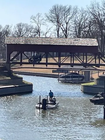 a view of a water fountain and a bench