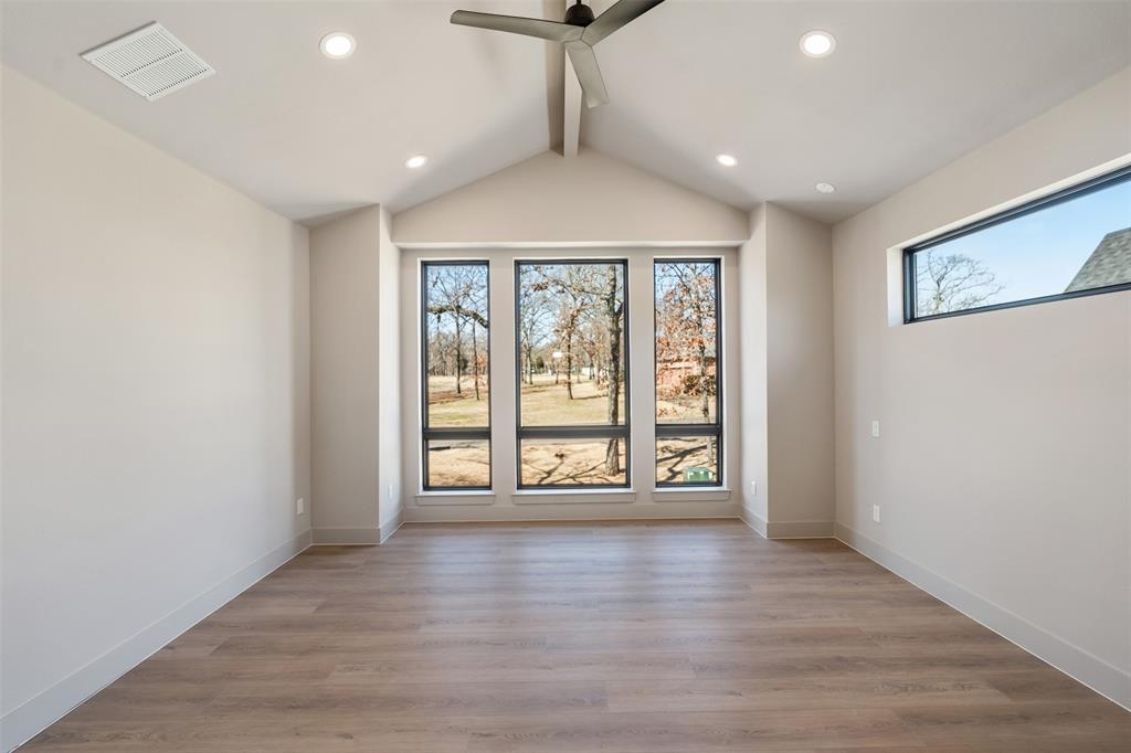 116 Pinnacle Club Drive Mabank, TX 75156 - Photo 20 of 40 a view of an empty room with wooden floor and a window