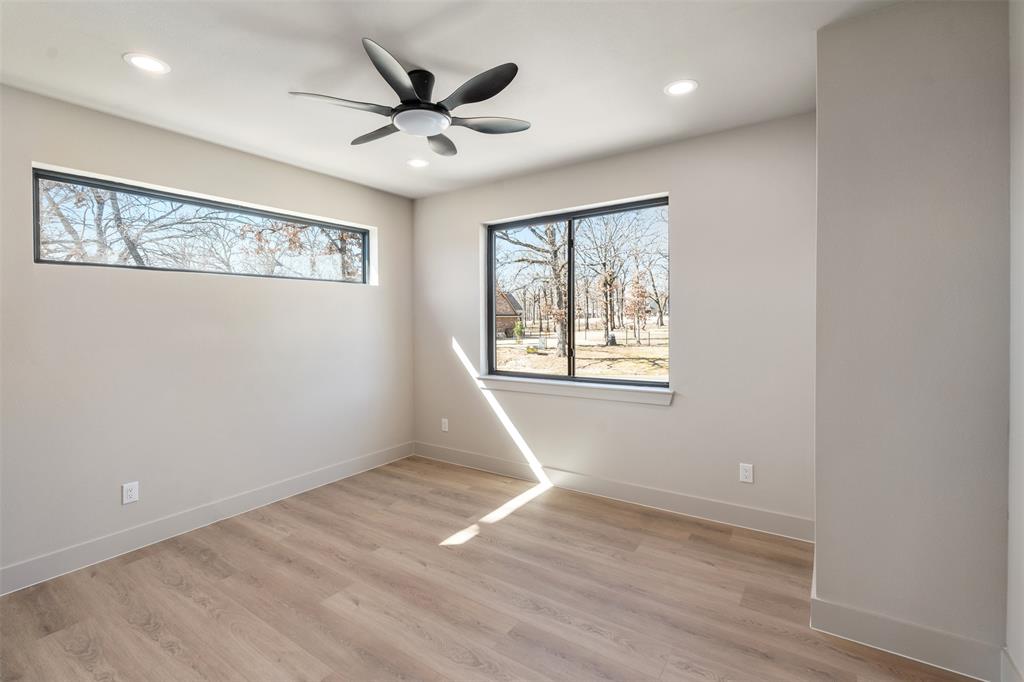 116 Pinnacle Club Drive Mabank, TX 75156 - Photo 28 of 40 wooden floor in an empty room with a window