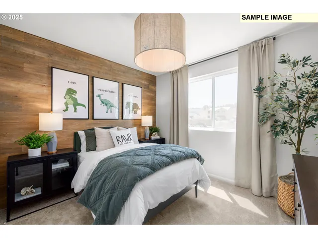 a bedroom with a bed and a large window