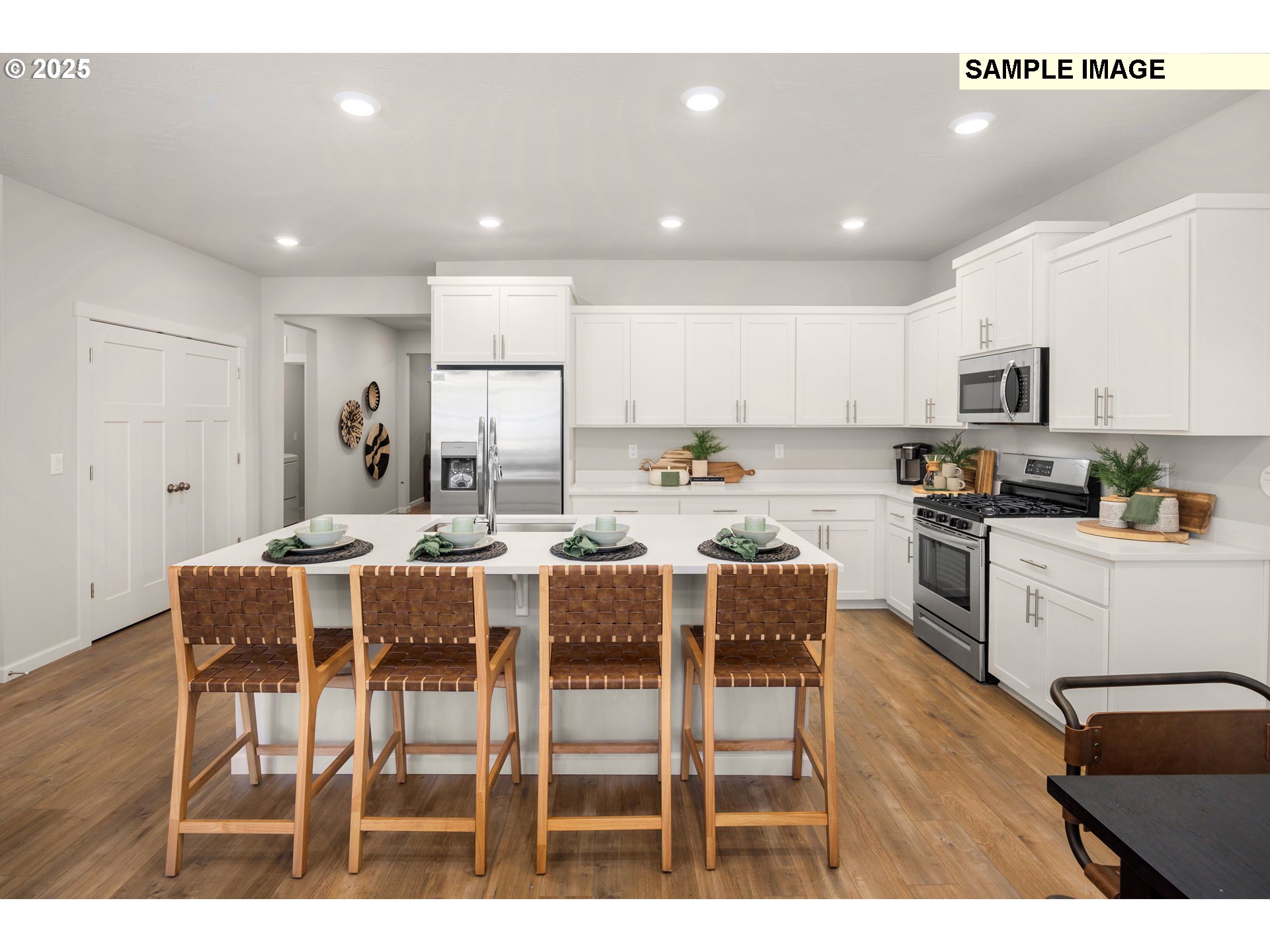 4301 Hackamore Court Southeast Albany, OR 97322 - Photo 3 of 24 a kitchen with kitchen island wooden cabinets and stainless steel appliances
