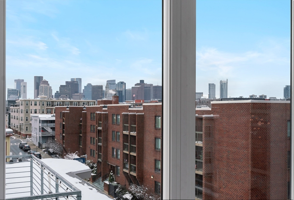 181 Maverick Street, Unit PH Boston, MA 02128 - Photo 14 of 20 a view of a city with tall buildings