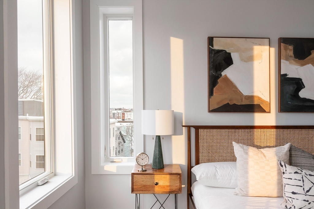 181 Maverick Street, Unit PH Boston, MA 02128 - Photo 9 of 20 a living room with furniture and a window