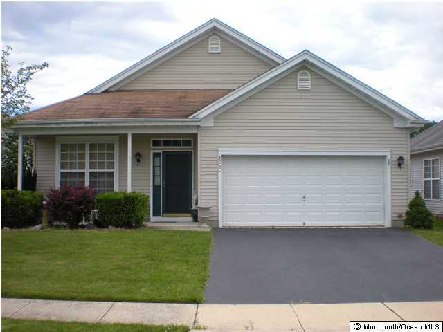 85 Sandpiper Road Barnegat, NJ 08005 - Photo 2 of 3 a front view of a house with a yard