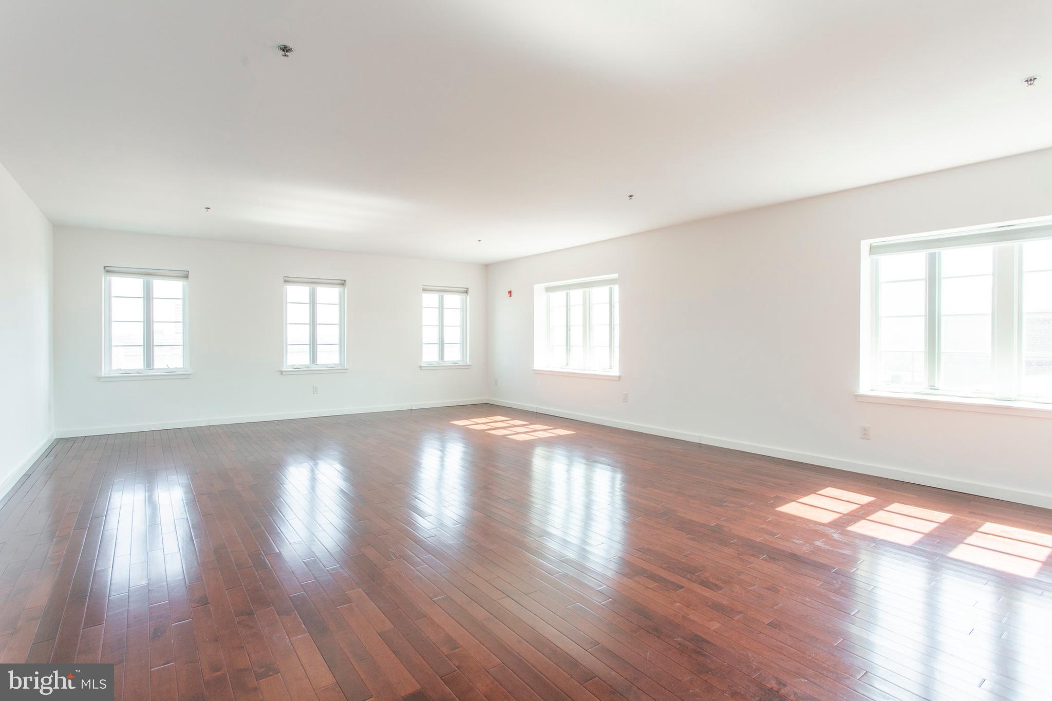 22 North Front Street, Unit PH1 Philadelphia, PA 19106 - Photo 2 of 42 a view of empty room with wooden floor and fan