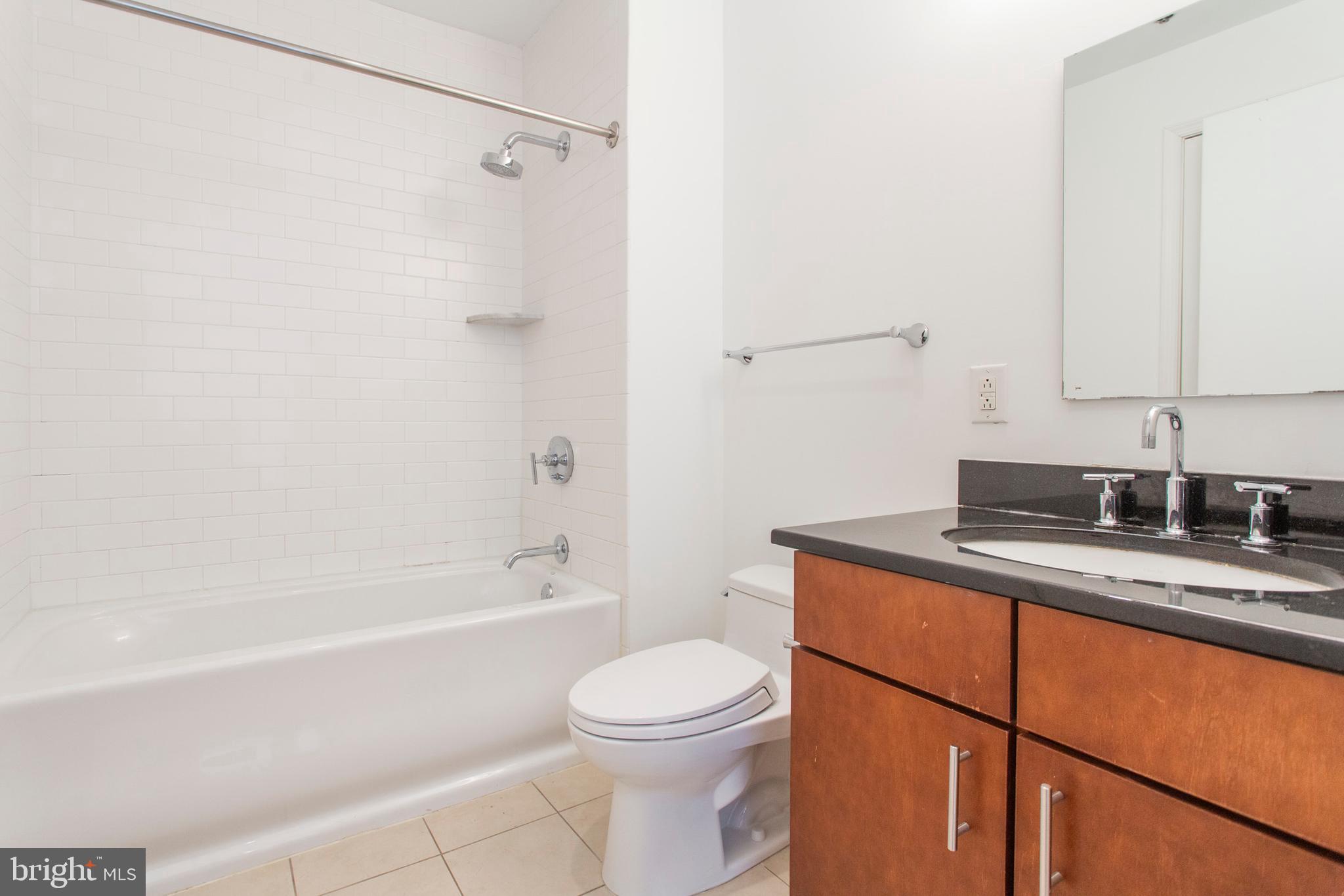 22 North Front Street, Unit PH1 Philadelphia, PA 19106 - Photo 19 of 42 a bathroom with a sink a toilet and shower