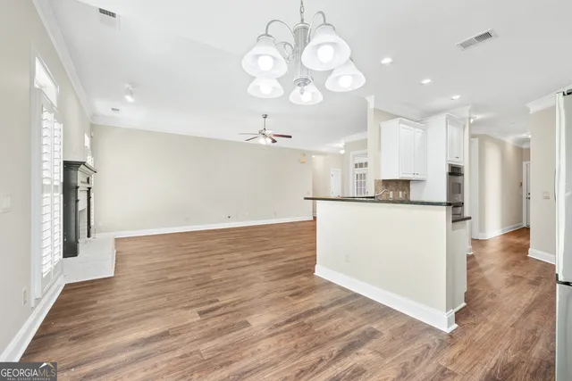 a view of kitchen with cabinets and stainless steel appliances
