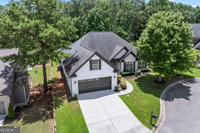 a front view of a house with garden