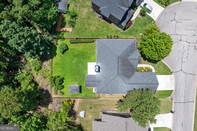 an aerial view of a house with a garden