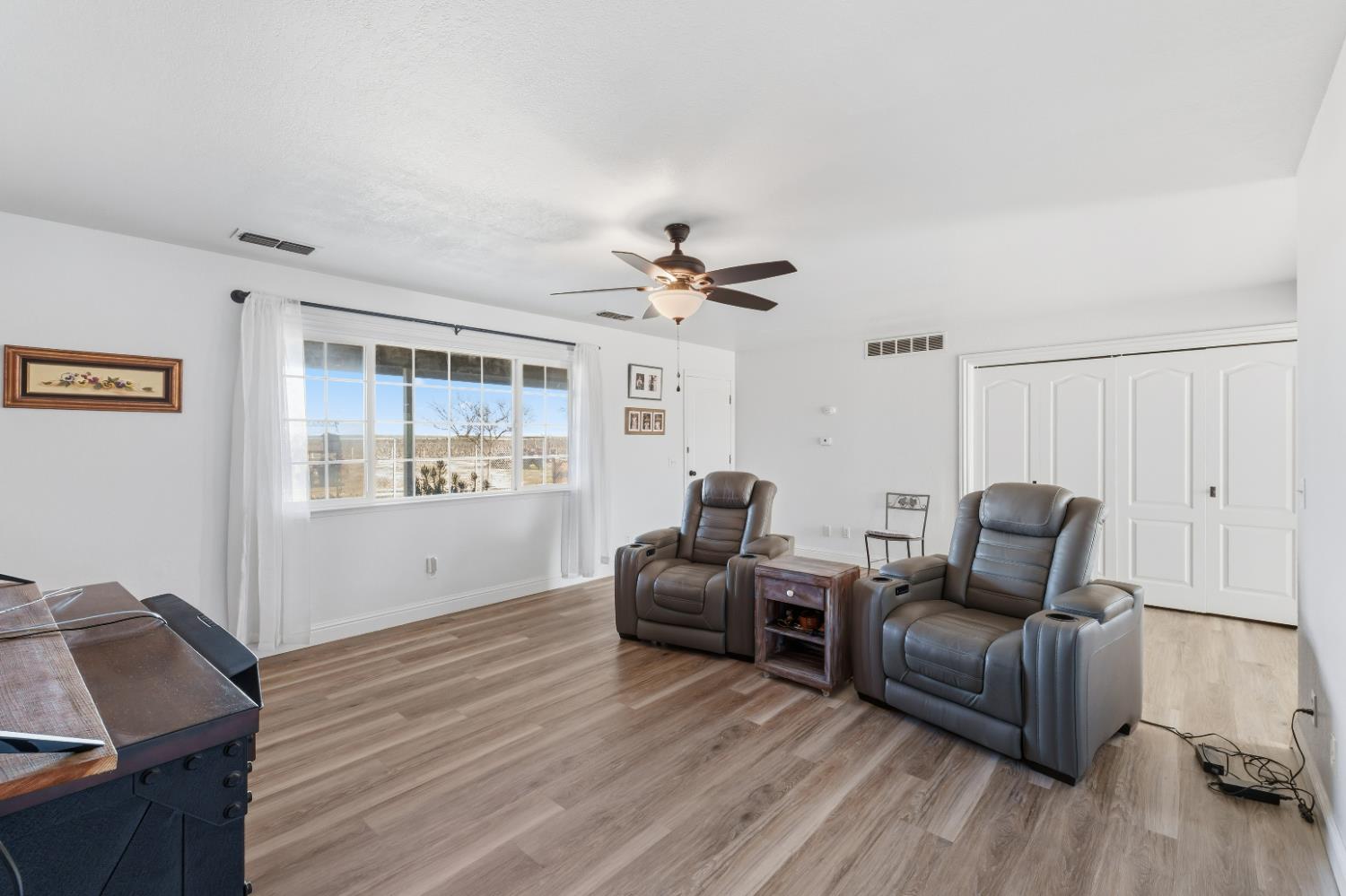 2938 North Trinity Avenue Kerman, CA 93630 - Photo 14 of 38 a living room with furniture and a large window