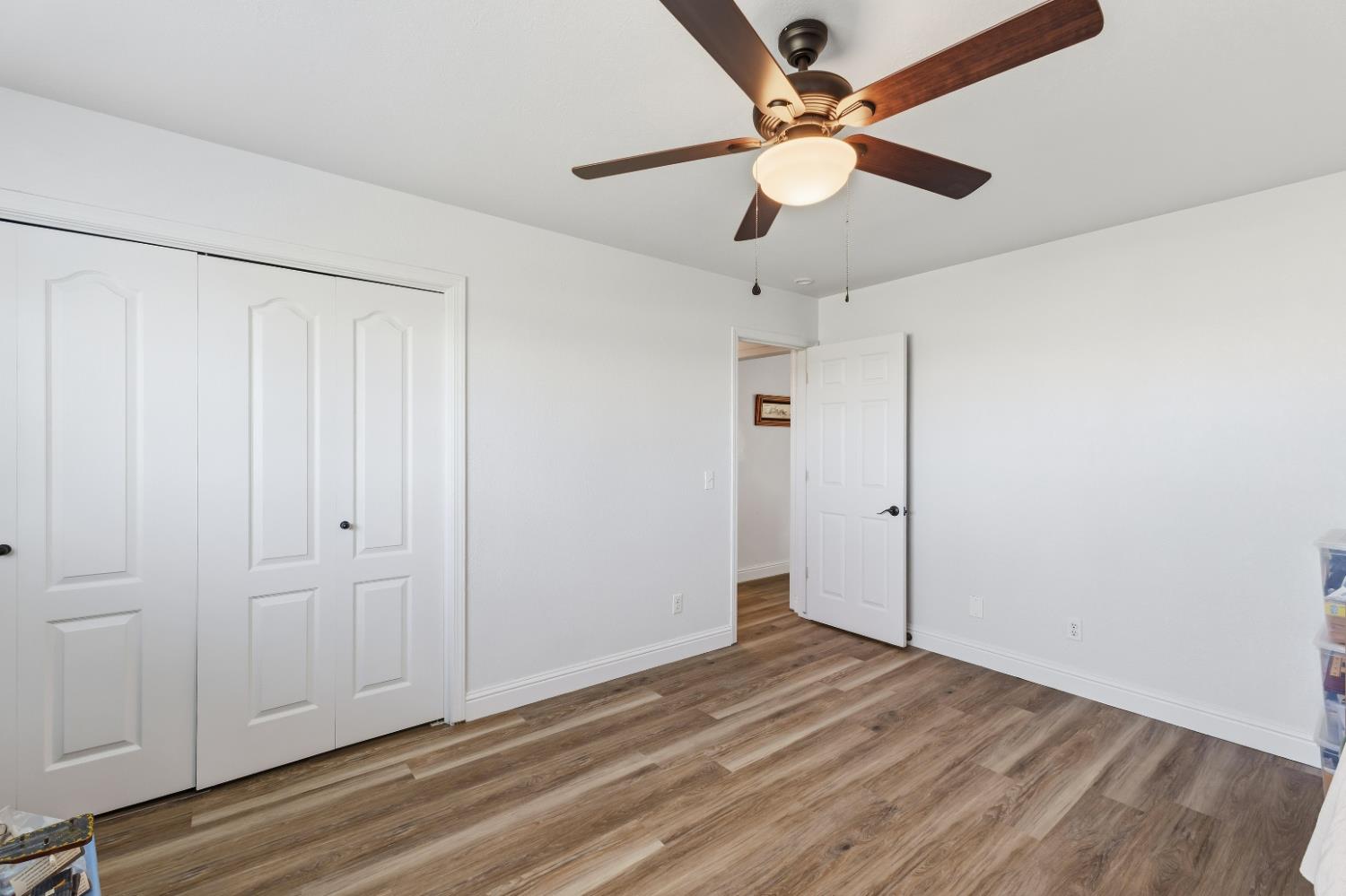 2938 North Trinity Avenue Kerman, CA 93630 - Photo 15 of 38 wooden floor in an empty room
