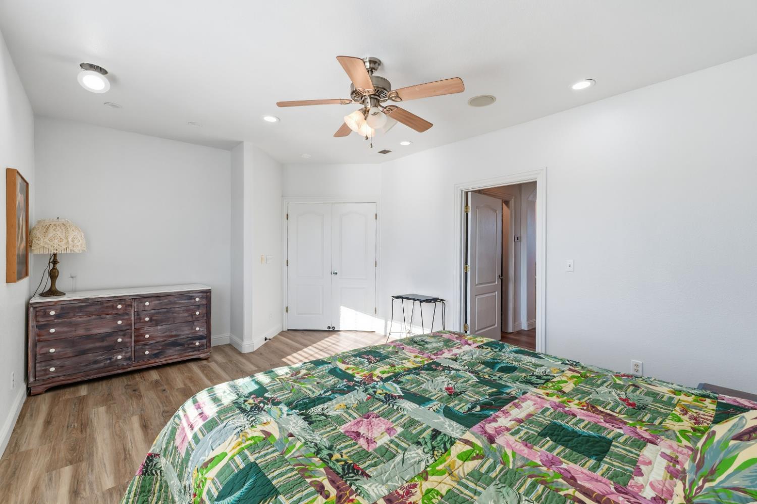 2938 North Trinity Avenue Kerman, CA 93630 - Photo 28 of 38 a bedroom with a bed and a dresser