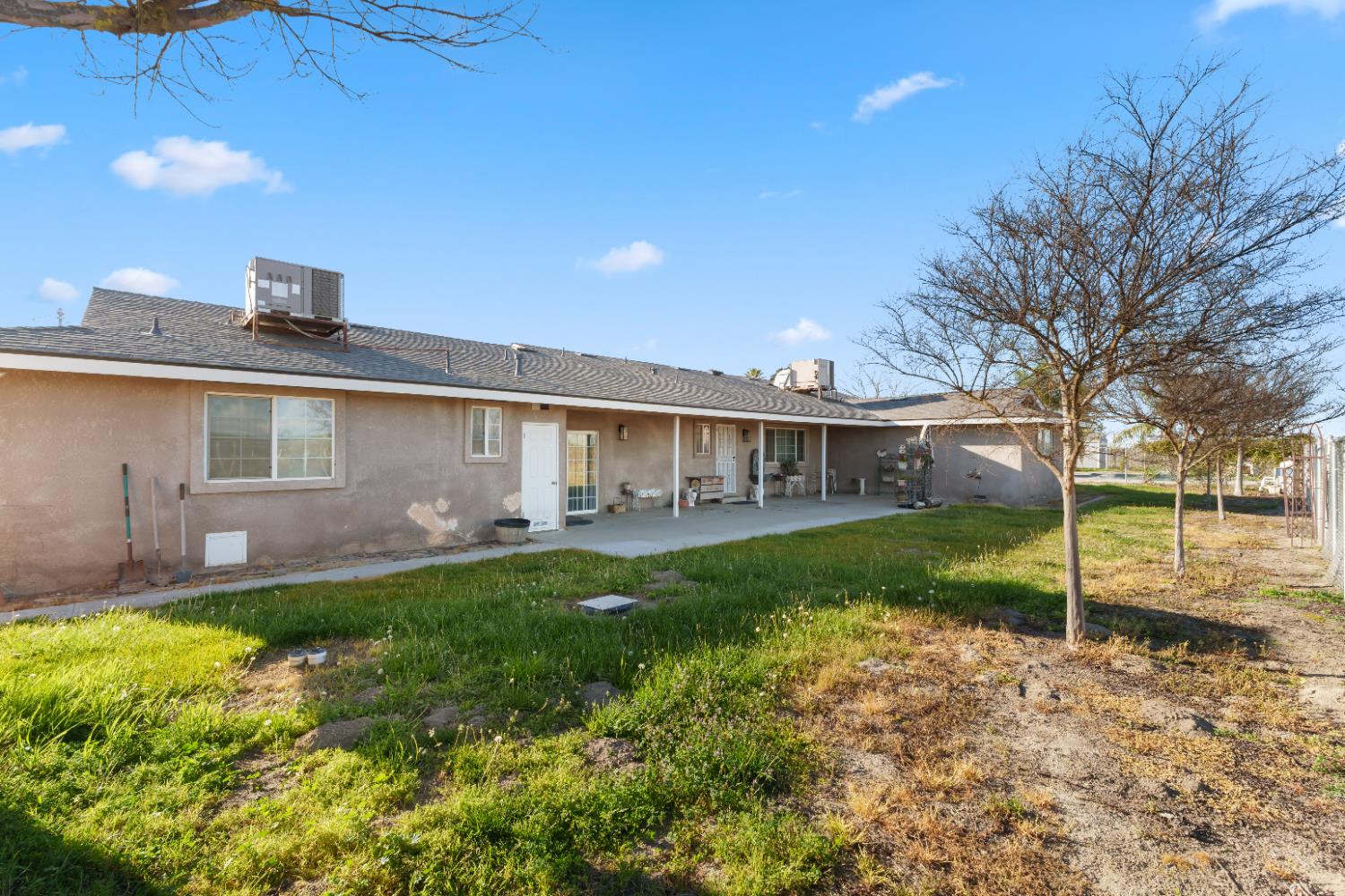 2938 North Trinity Avenue Kerman, CA 93630 - Photo 32 of 38 a front view of a house with garden