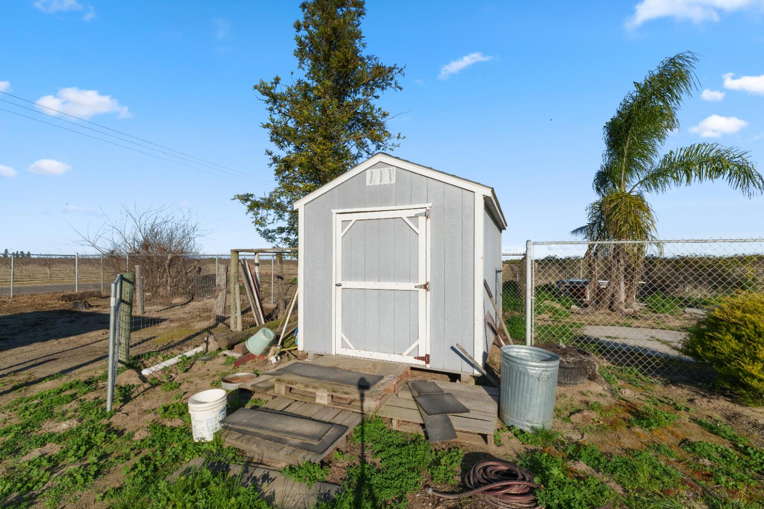 2938 North Trinity Avenue Kerman, CA 93630 - Photo 38 of 38 a front view of a house with a yard
