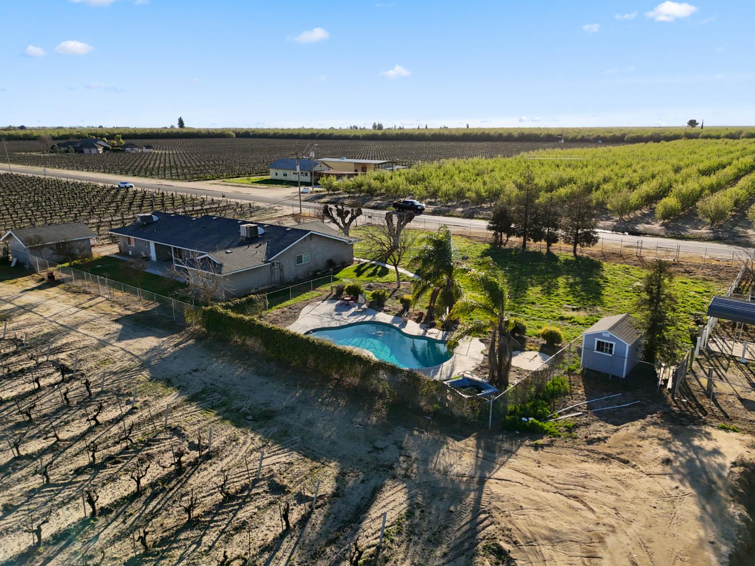 2938 North Trinity Avenue Kerman, CA 93630 - Photo 5 of 38 a view of a lake with lawn chairs
