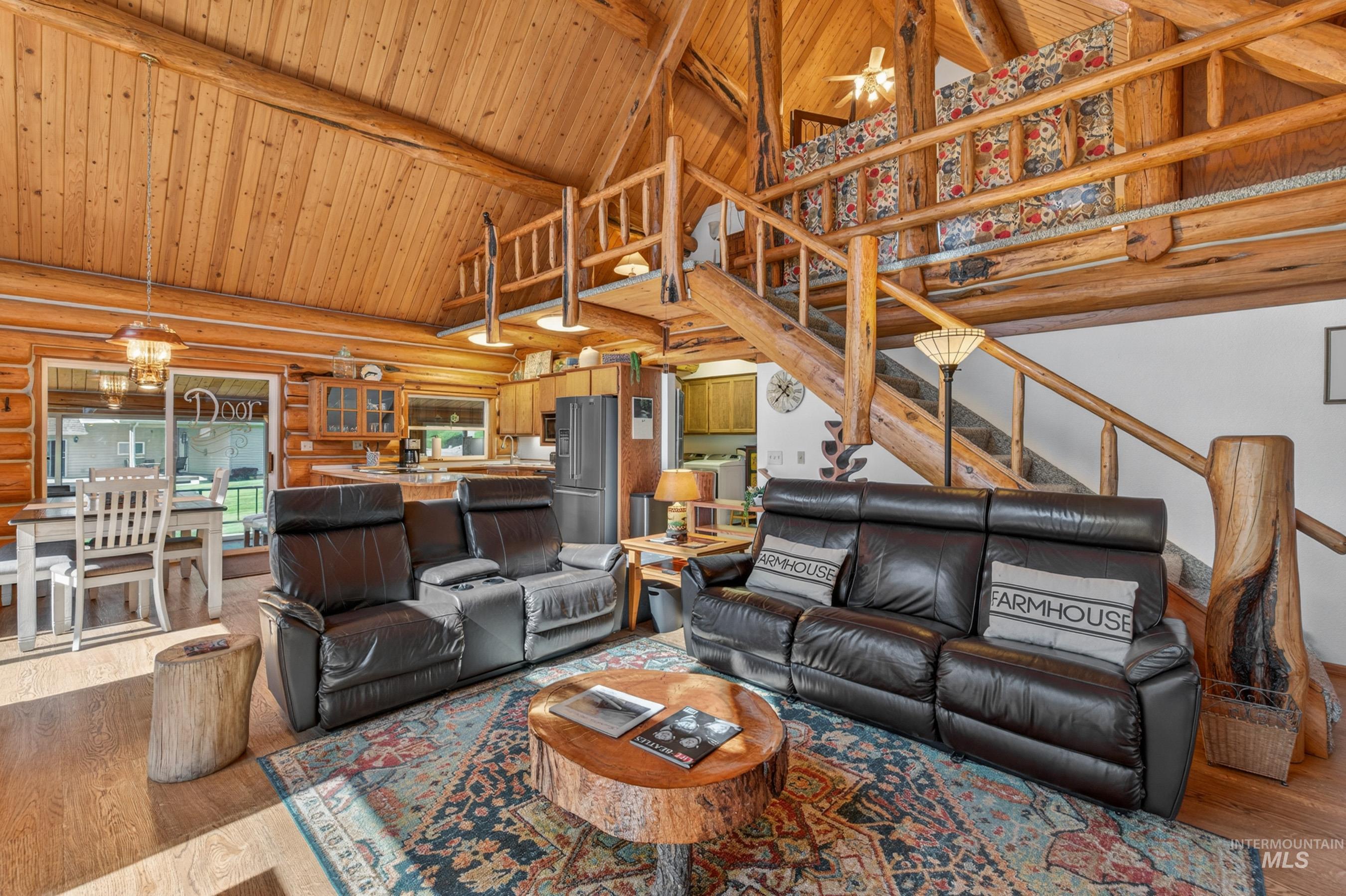215 Doumecq Road White Bird, ID 83554 - Photo 22 of 50 Vaulted wood-paneled ceilings with exposed log beams throughout