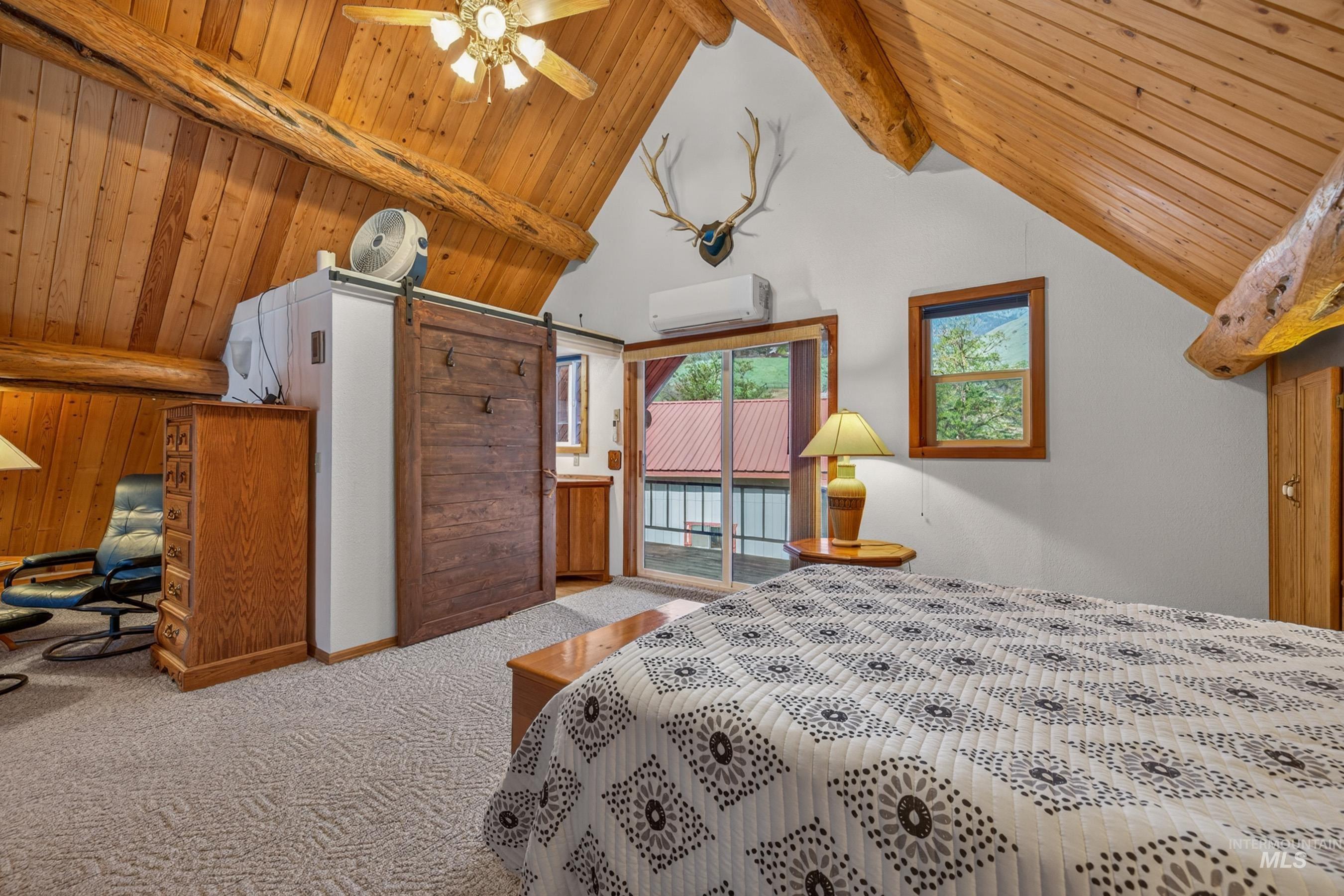 215 Doumecq Road White Bird, ID 83554 - Photo 24 of 50 Vaulted wood-paneled ceilings with exposed log beams
