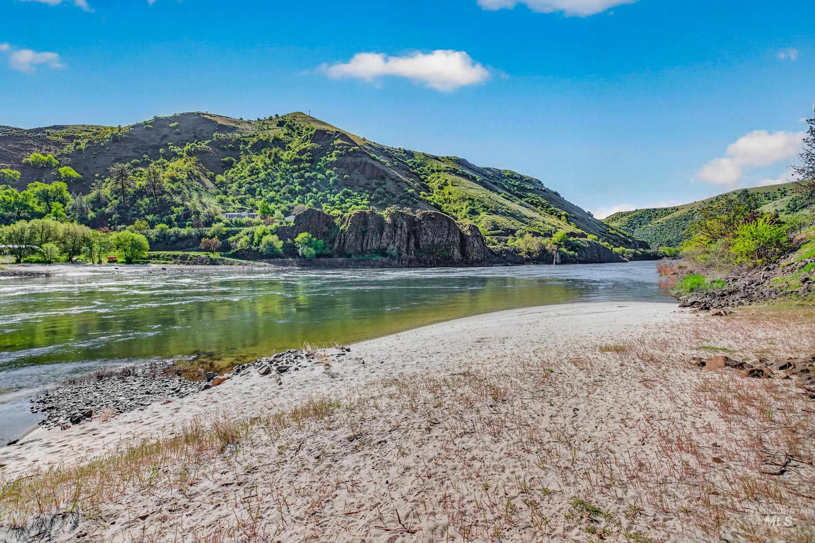 215 Doumecq Road White Bird, ID 83554 - Photo 3 of 50 Expansive sandy riverbank with verdant hills and a serene waterway