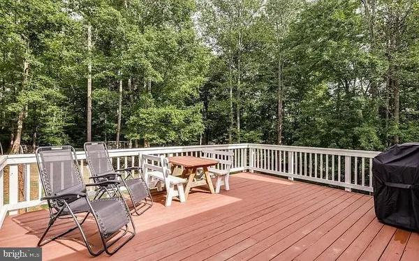 a view of a patio with wooden floor
