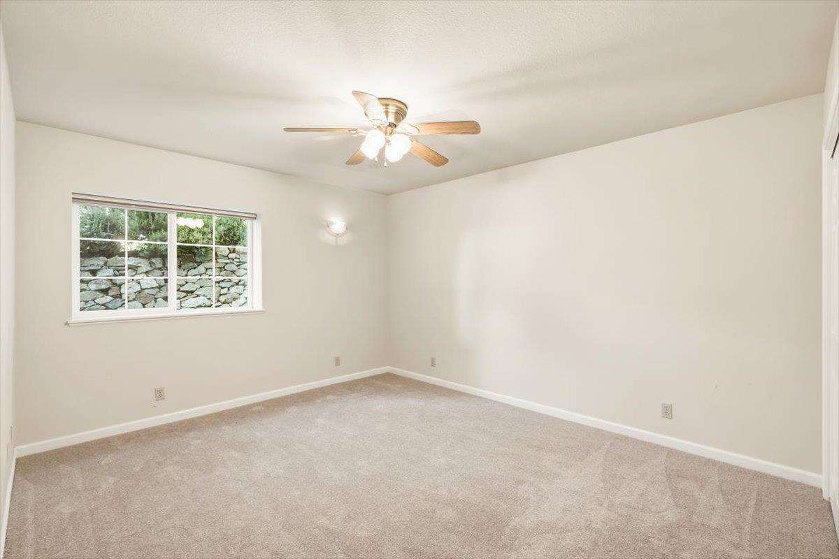 12531 Lowhills Road Nevada City, CA 95959 - Photo 48 of 92 an empty room with windows and ceiling fan