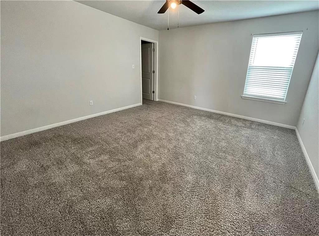 317 Serpens Street Georgetown, TX 78628 - Photo 4 of 13 an empty room with windows and closet
