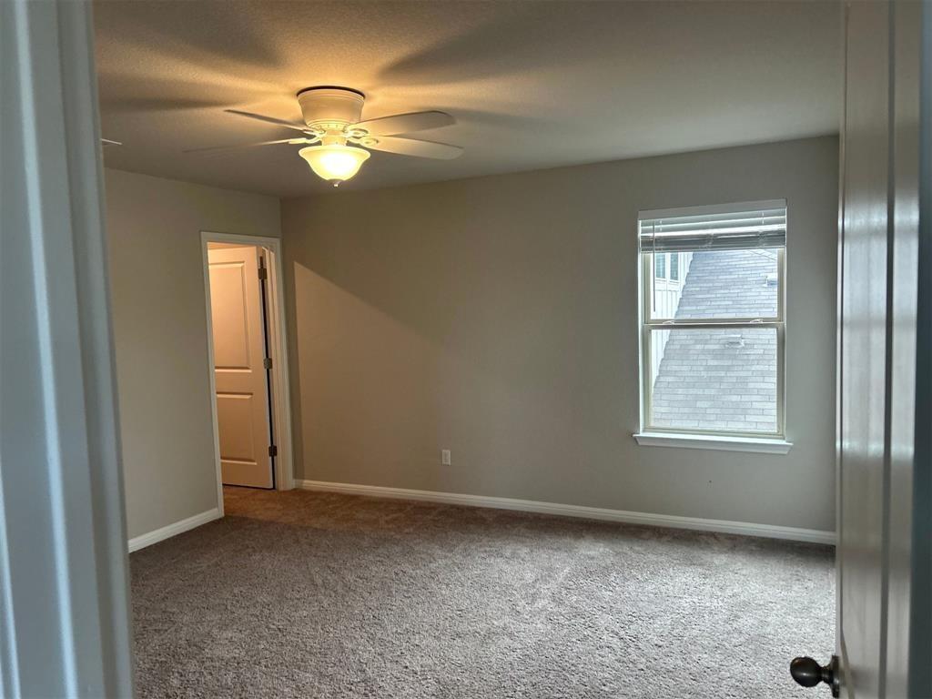 317 Serpens Street Georgetown, TX 78628 - Photo 9 of 13 a view of an empty room with a window