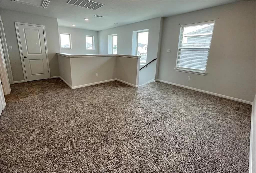 317 Serpens Street Georgetown, TX 78628 - Photo 10 of 13 an empty room with windows