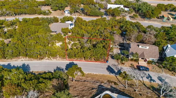 an aerial view of residential house with parking space