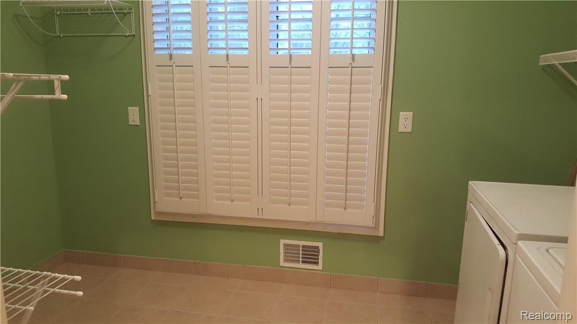 9118 Rucker Road Grosse Ile, MI 48138 - Photo 17 of 47 1st floor laundry room.